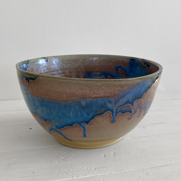 Ceramic bowl with blue interior on a white surface