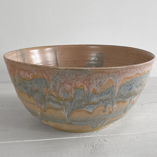 Ceramic bowl with a textured surface on a light gray background